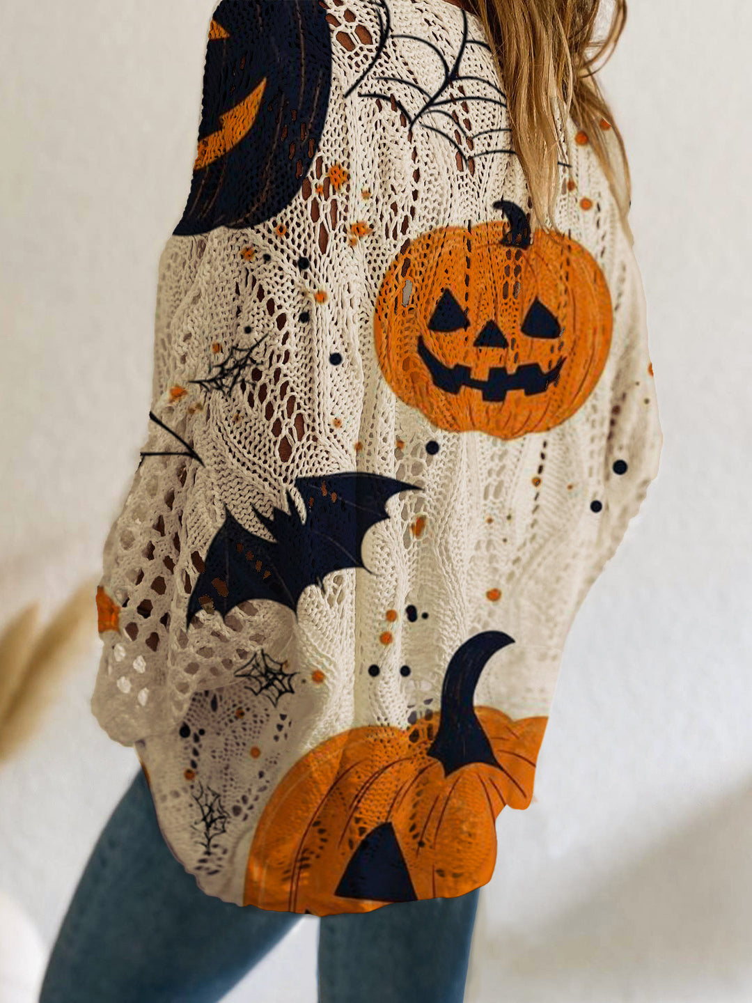 The Elara Pumpkin Night Openwork Sweater