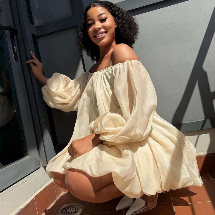The Elara Multi-Way Pleated Flowy Mini Dress