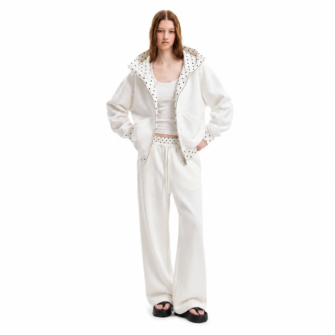 White polka-dot hooded matching set on female model, front view