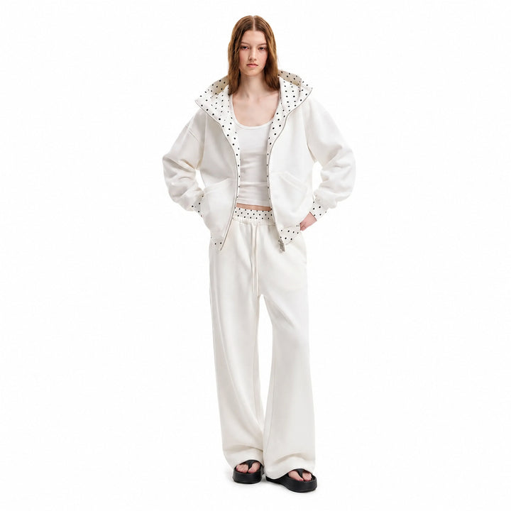 White polka-dot hooded matching set on female model, front view