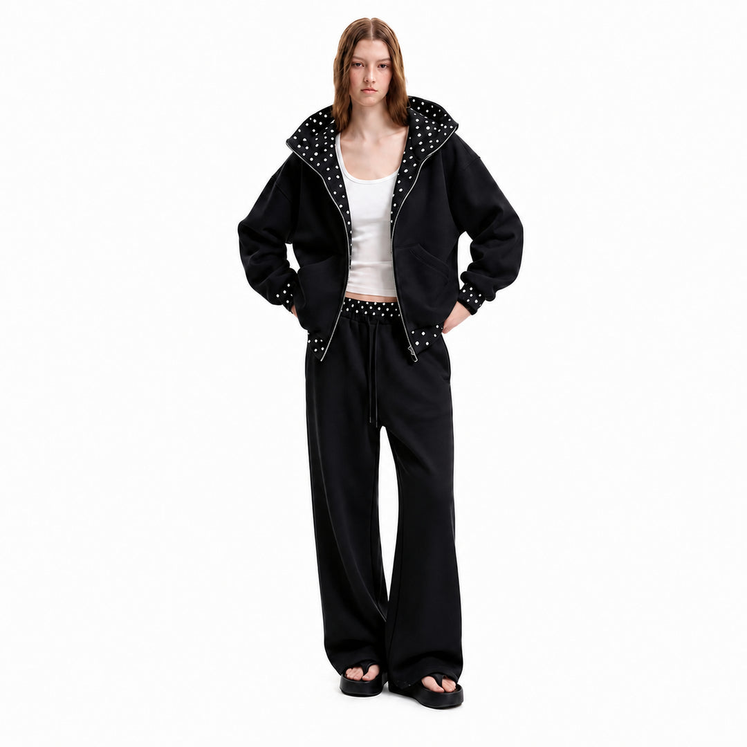 Black polka-dot hooded matching set on female model, front view