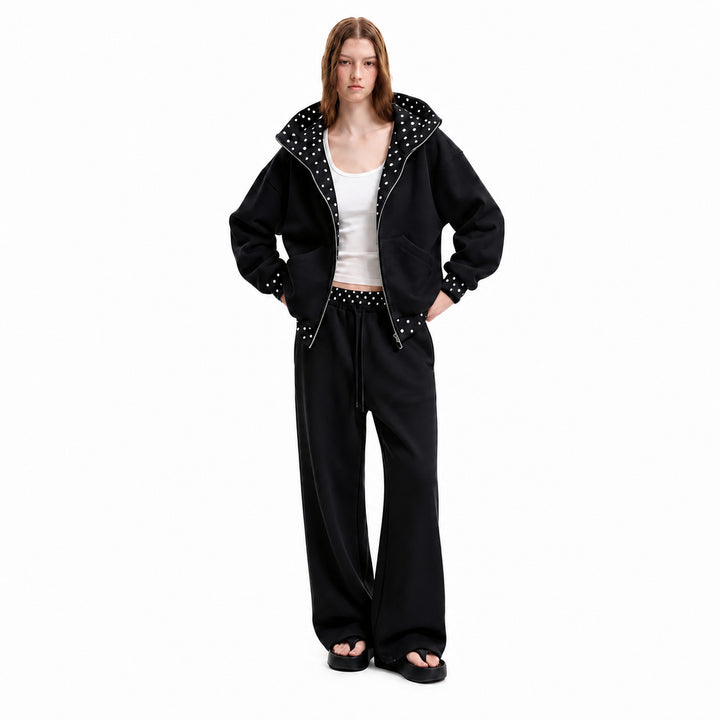 Black polka-dot hooded matching set on female model, front view