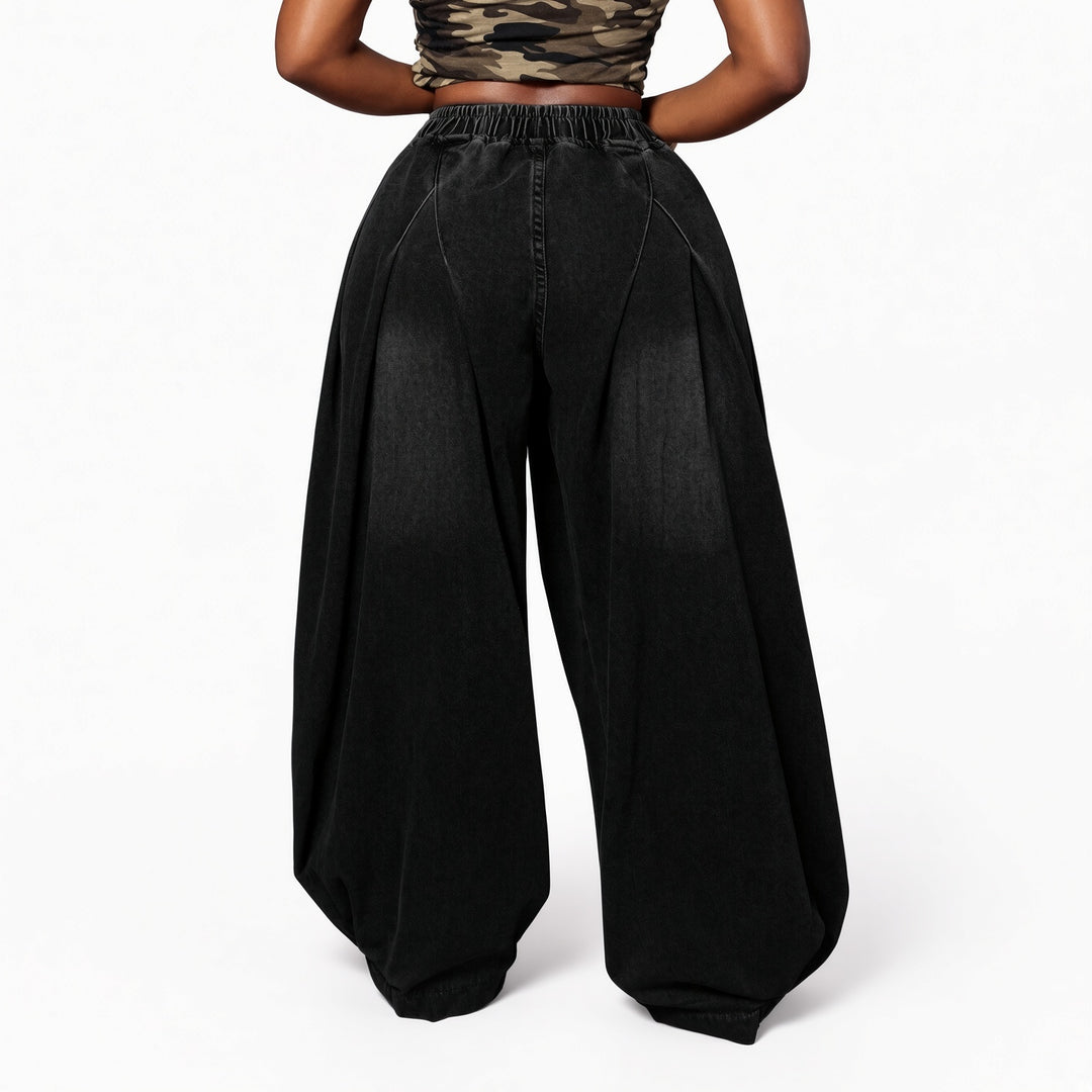 The Elara stretch wide-leg jeans in Black, back view