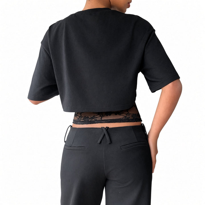 The Elara lace-waist layered crop tee in Black, back view