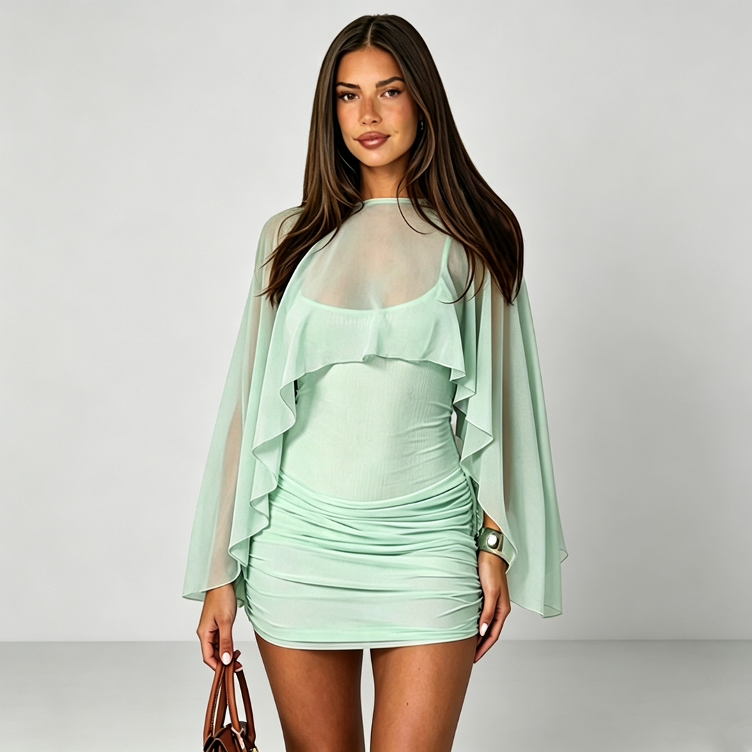 The Elara Sheer Cape Ruched Mini Dress
