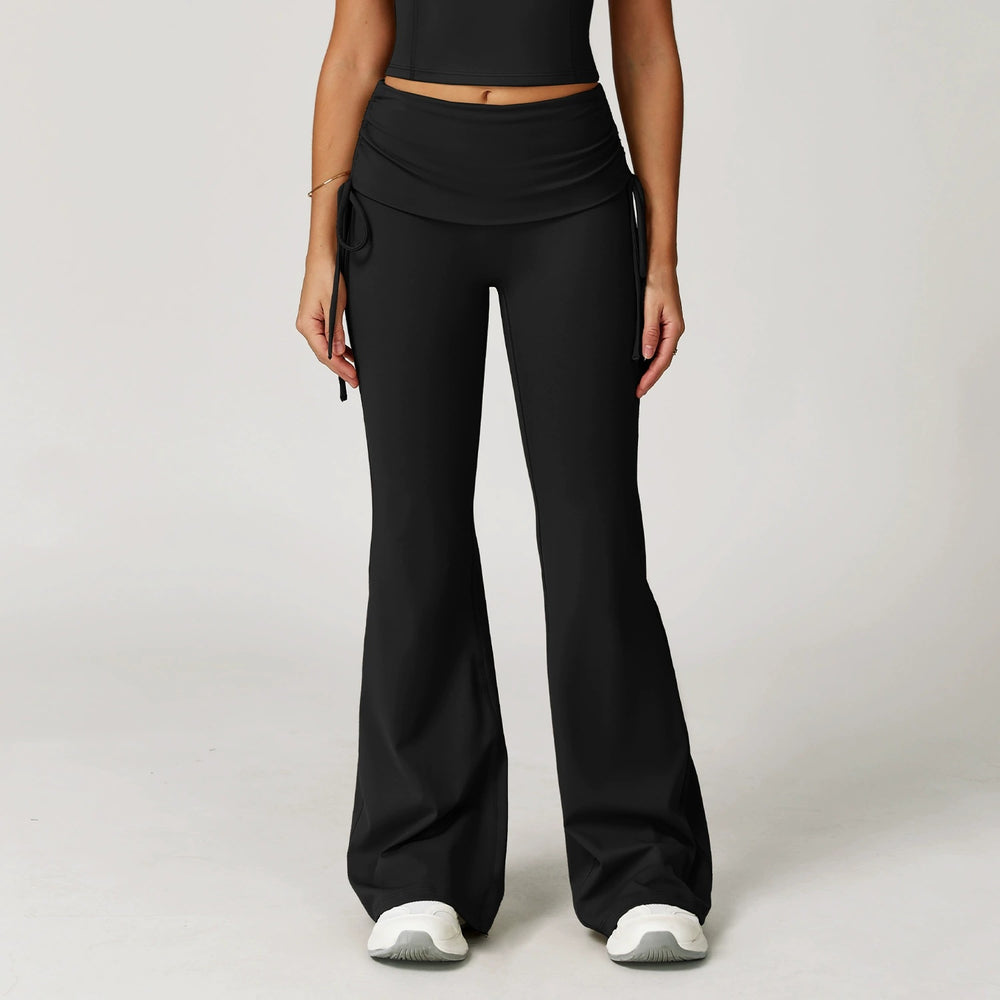 The Elara foldover high-waist flare pants in black front view