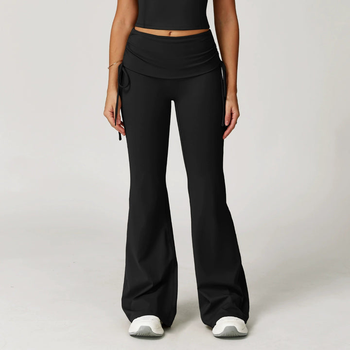 The Elara foldover high-waist flare pants in black front view