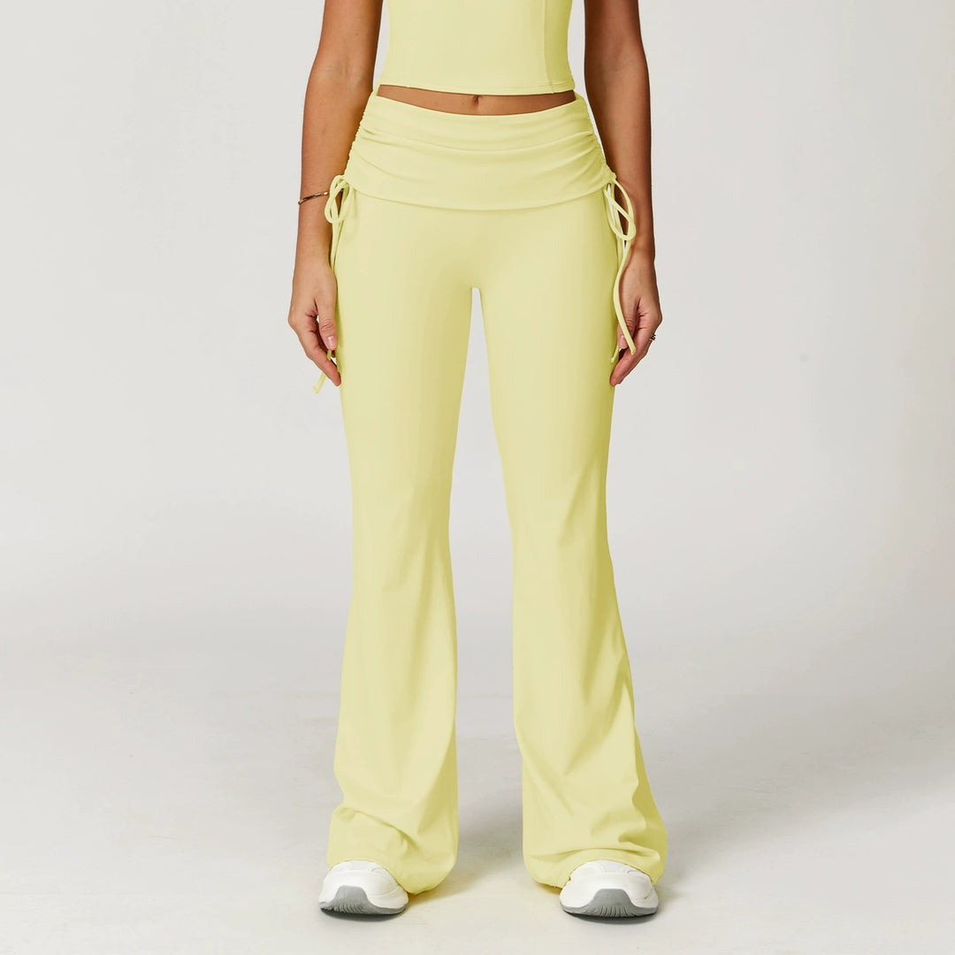 The Elara foldover high-waist flare pants in yellow front view