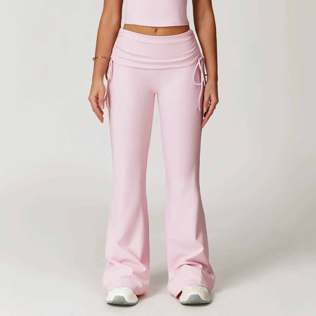 The Elara foldover high-waist flare pants in pink front view