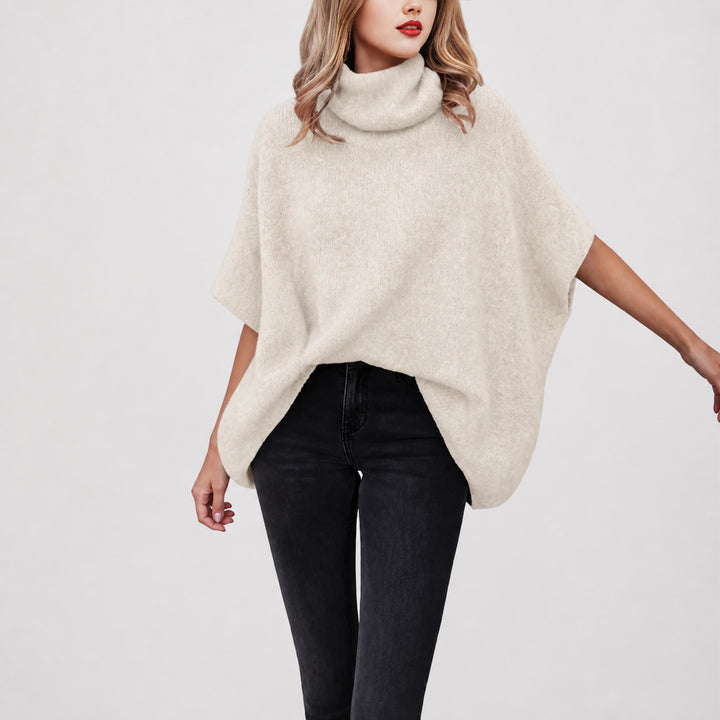 The Elara alpaca-blend turtleneck poncho in ivory