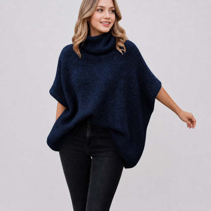 The Elara alpaca-blend turtleneck poncho in navy