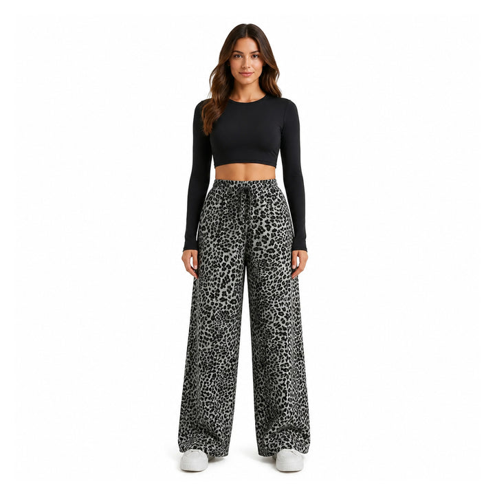 The Elara Relaxed Leopard Wide-Leg Pants in black grey, front view
