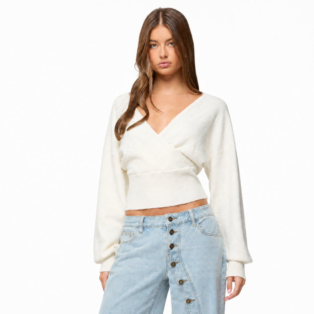 White cross-front tie-back knit sweater on model, front view