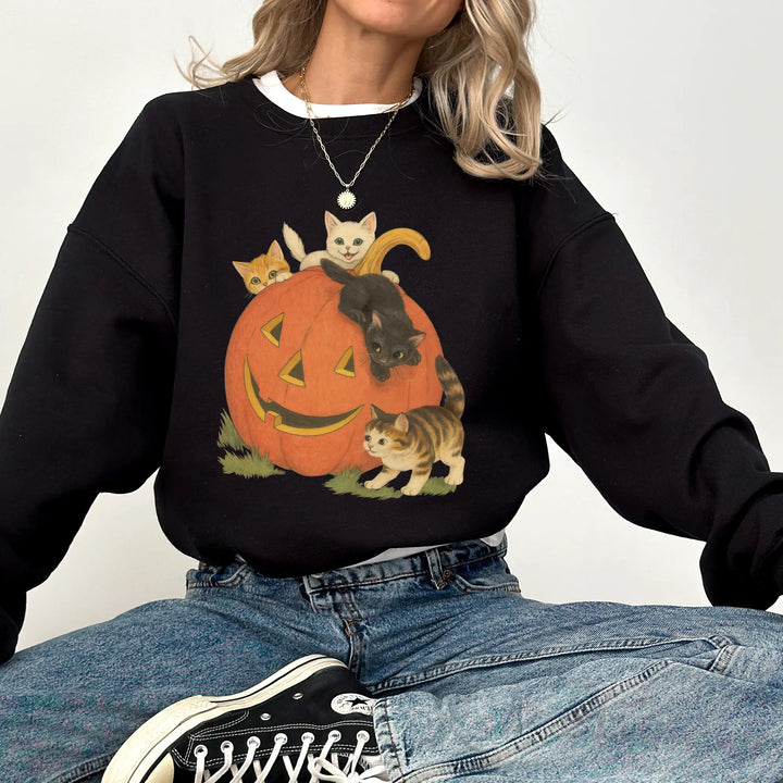 Black heavyweight pumpkin cats Halloween crewneck sweatshirt on a woman