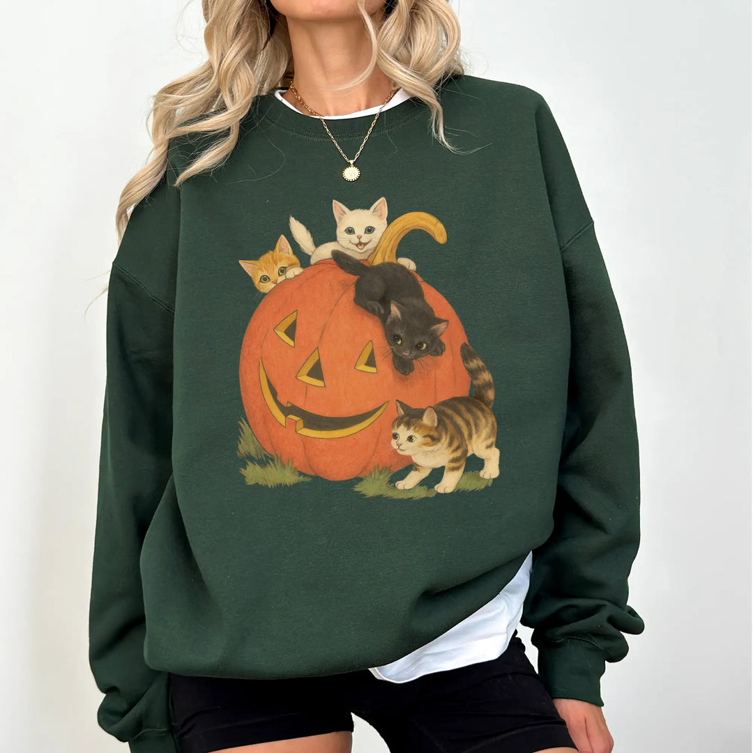 Dark green heavyweight pumpkin cats Halloween crewneck sweatshirt on a woman