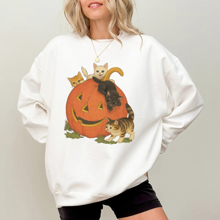 White heavyweight pumpkin cats Halloween crewneck sweatshirt on a woman