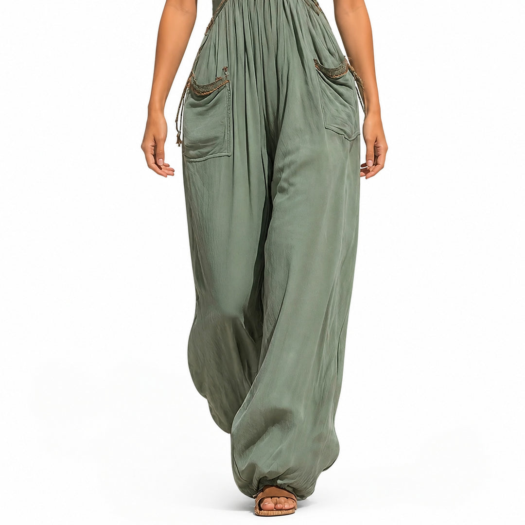 Green jumpsuit pocket and drape detail