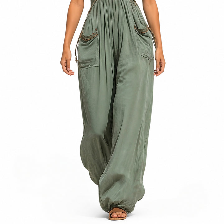Green jumpsuit pocket and drape detail