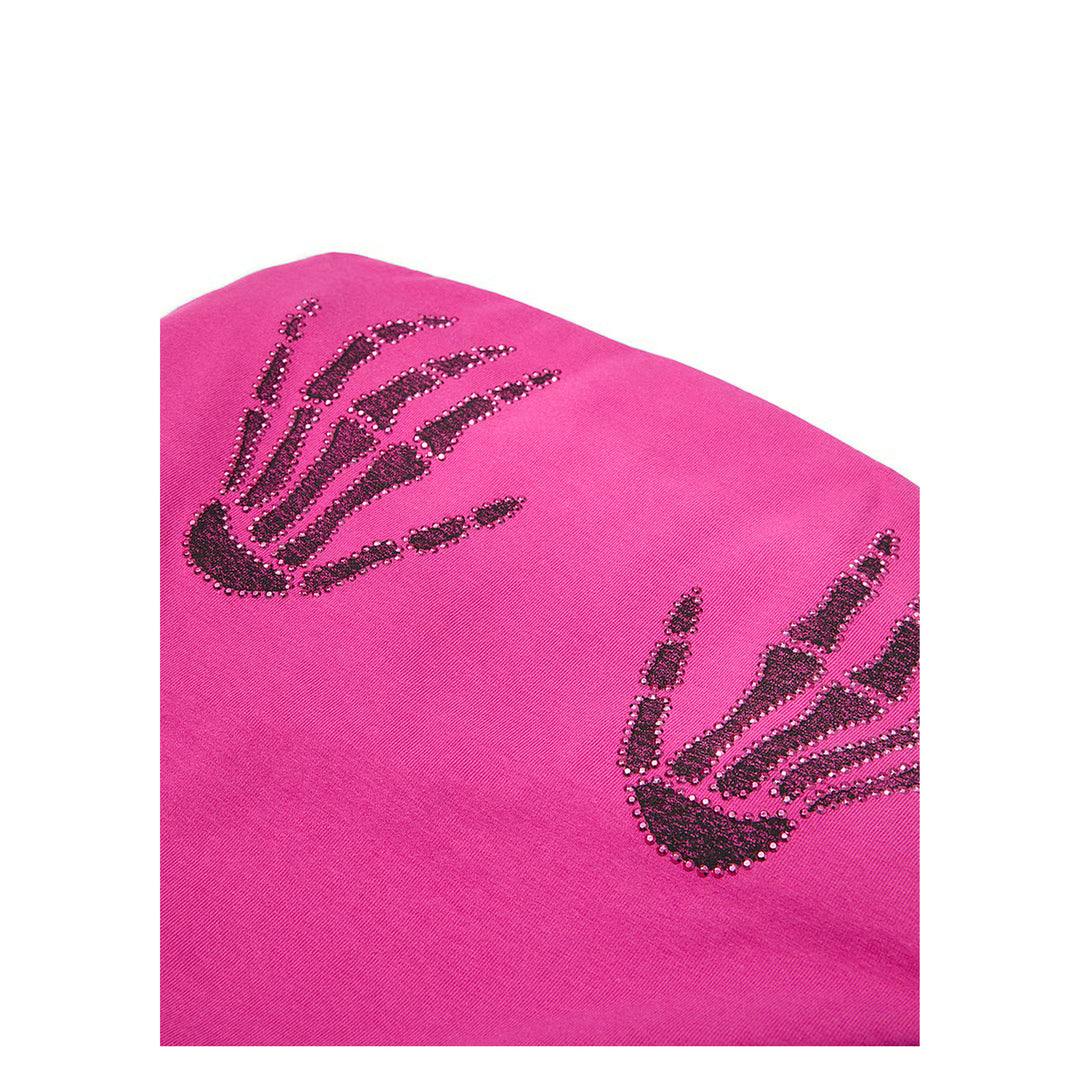 Close view of black sparkling skeleton-hand graphics on pink cotton-blend fabric