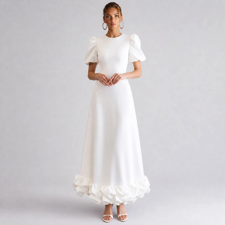 The Elara Amorette sculpted ruffle maxi dress in ivory, front view
