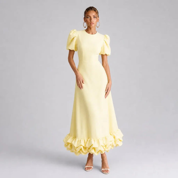 The Elara Amorette sculpted ruffle maxi dress in yellow, front view