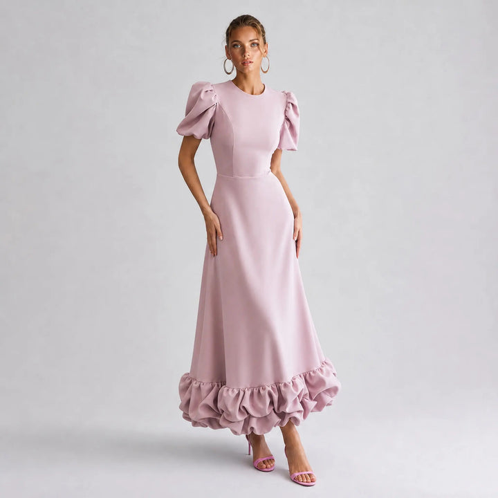 The Elara Amorette sculpted ruffle maxi dress in pink, front view