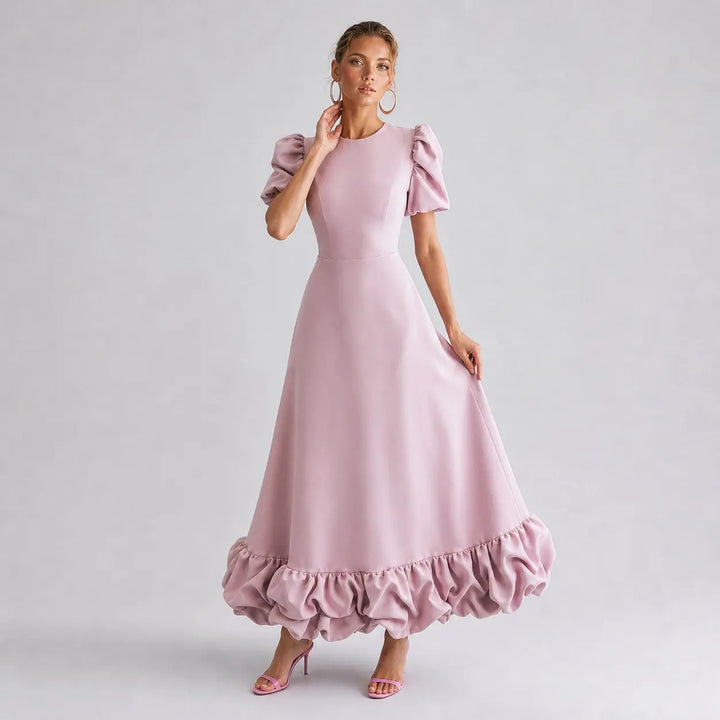 Pink Amorette maxi dress in an elegant angled pose