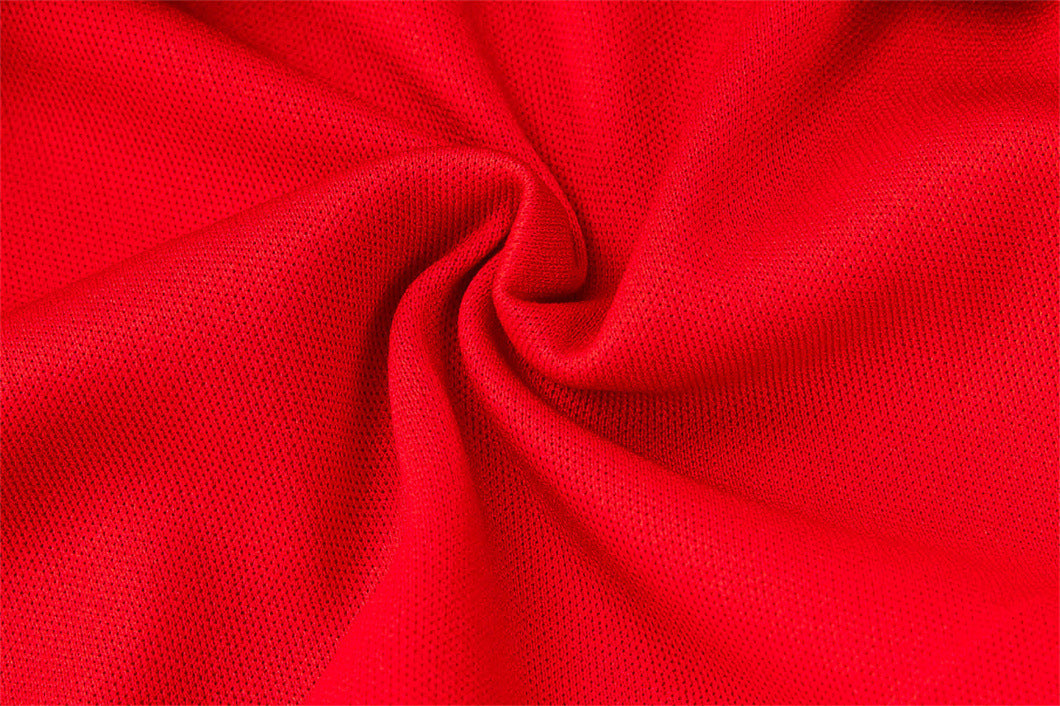 Close view of fine red glitter knit texture