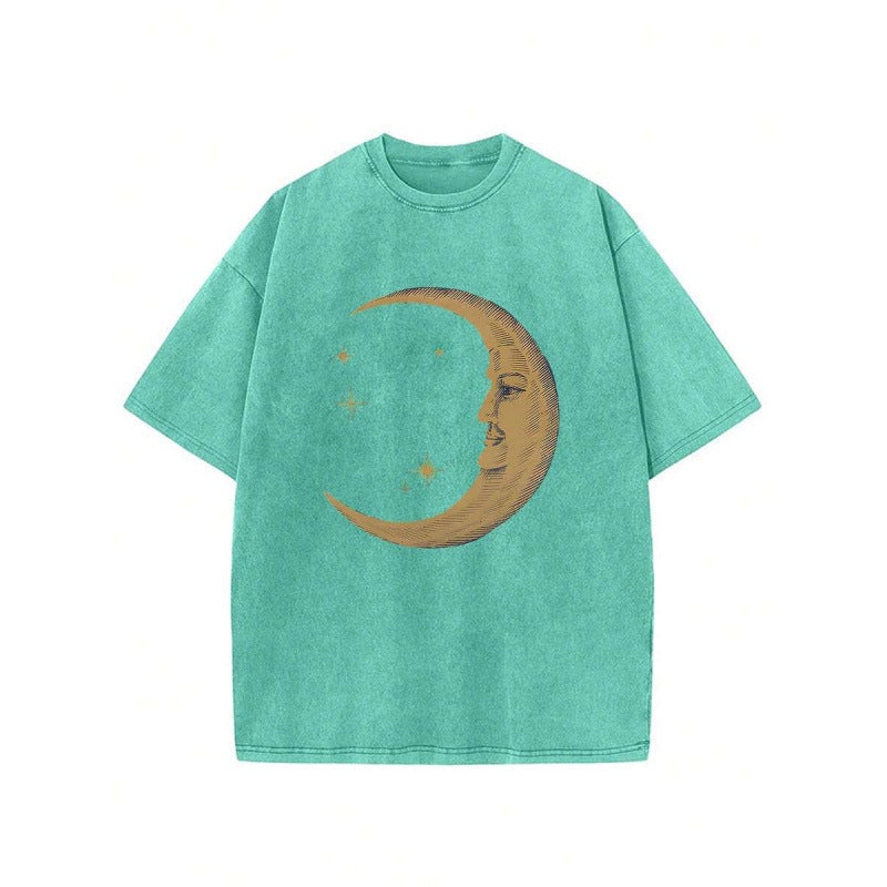 The Elara washed cotton crescent moon graphic T-shirt in Grass Green, front view