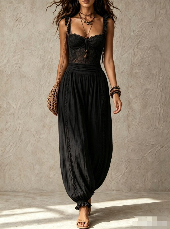 The Elara lace-bodice draped jumpsuit in Black, front view