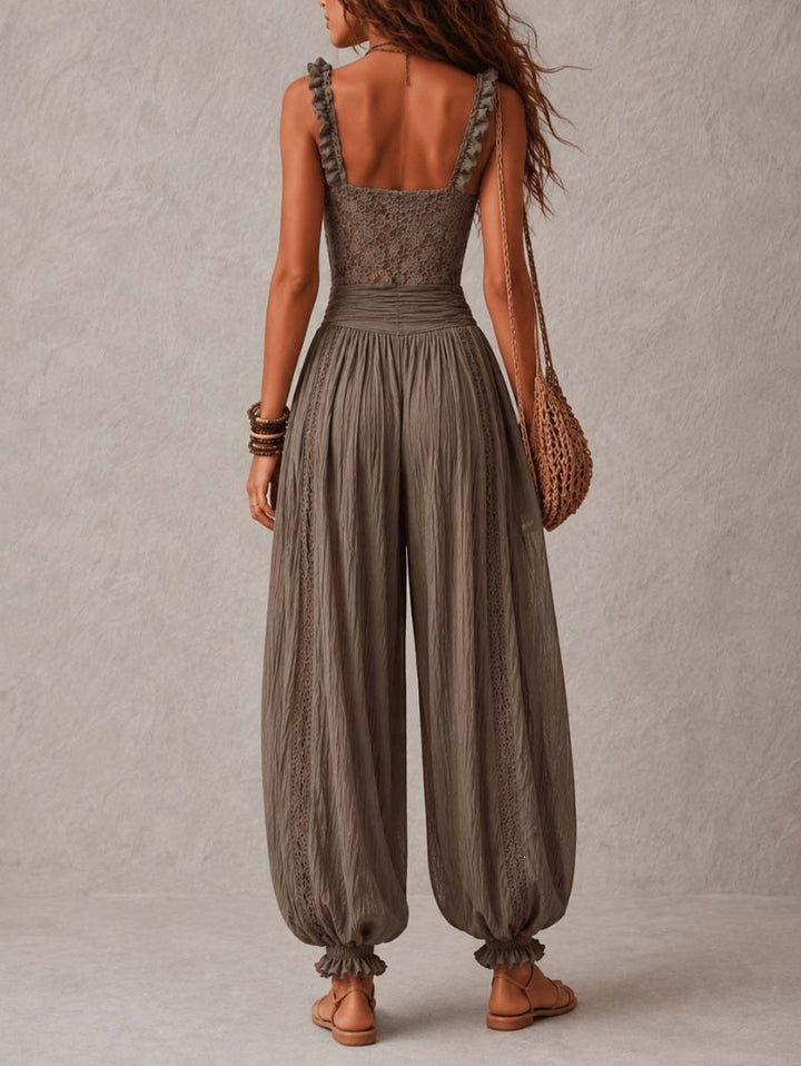 Back view of The Elara lace-bodice draped jumpsuit in Gray
