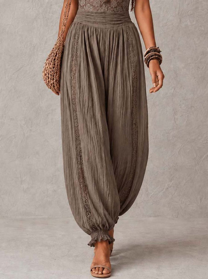 The Elara Gray jumpsuit lace bodice and draped leg detail