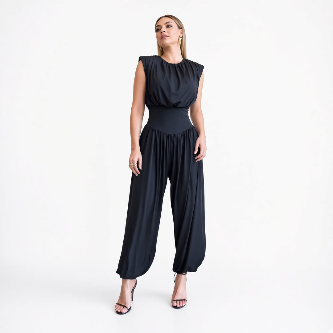 The Elara padded-shoulder harem jumpsuit in Navy, front view
