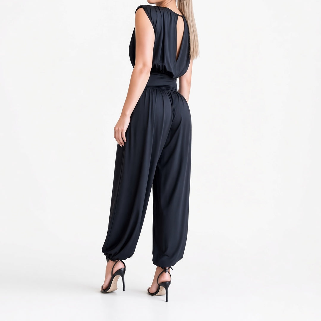 The Elara padded-shoulder harem jumpsuit in Navy, back view