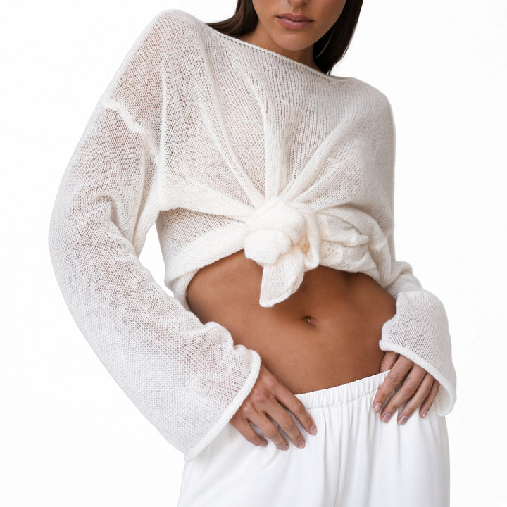 The Elara White sheer knit cover-up top styled at the waist