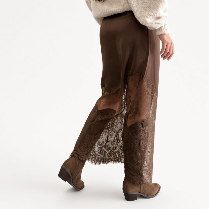 The Elara Brown lace-panel satin maxi skirt, side view