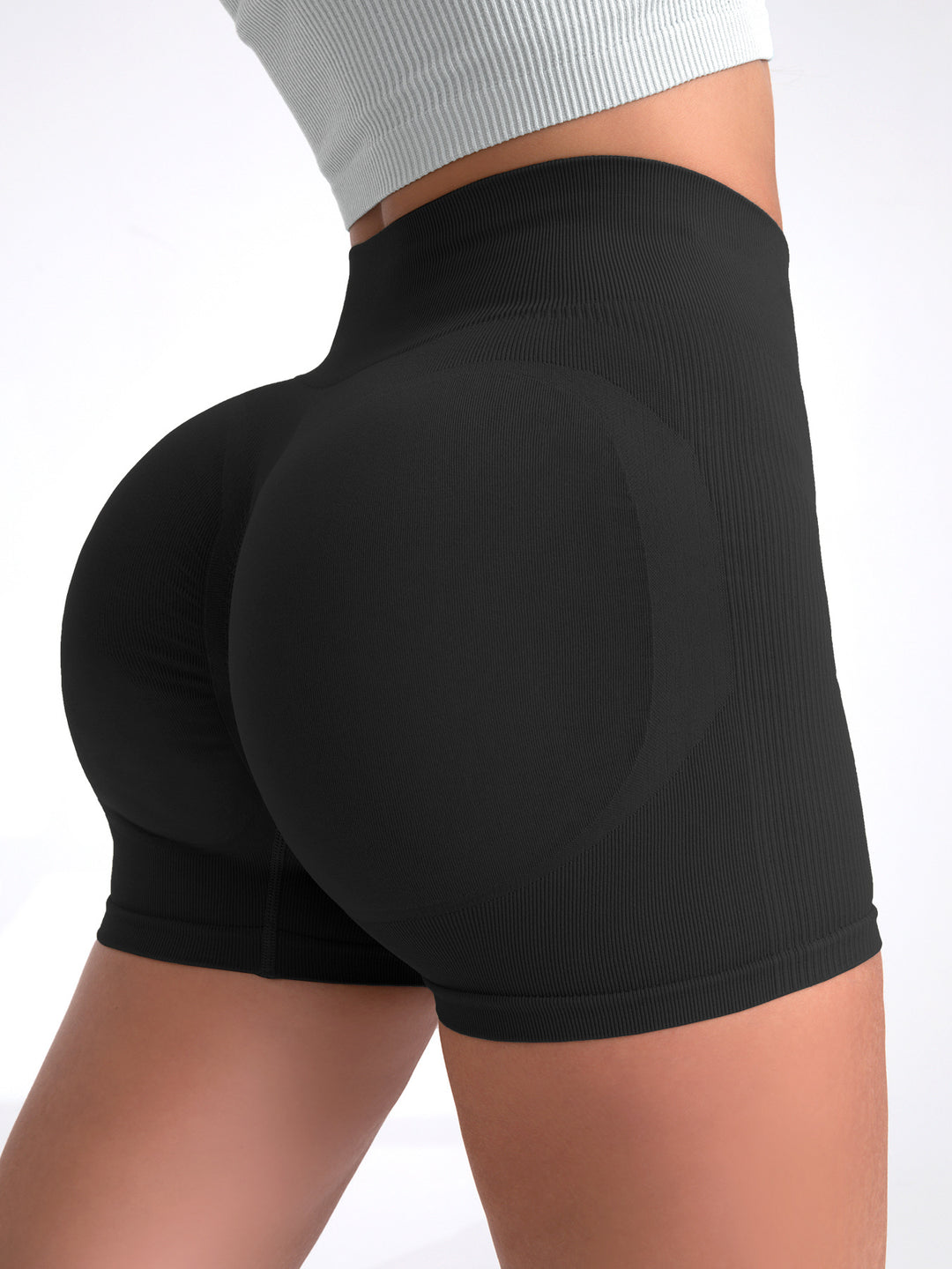 The Elara contour quick-dry yoga shorts in Black, back view