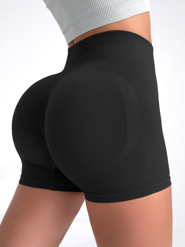 The Elara contour quick-dry yoga shorts in Black, back view