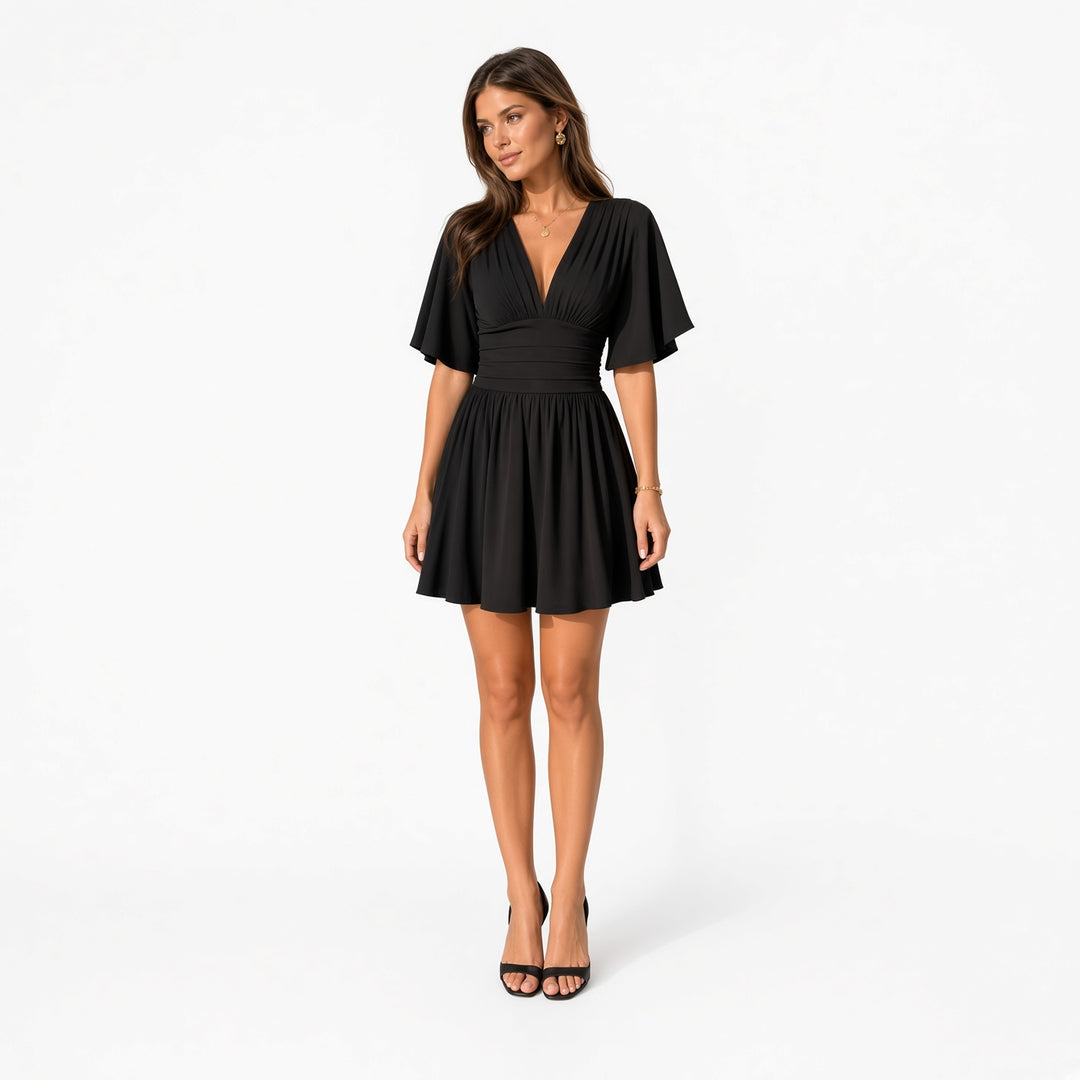 The Elara flutter-sleeve dress-style romper in Black, front view
