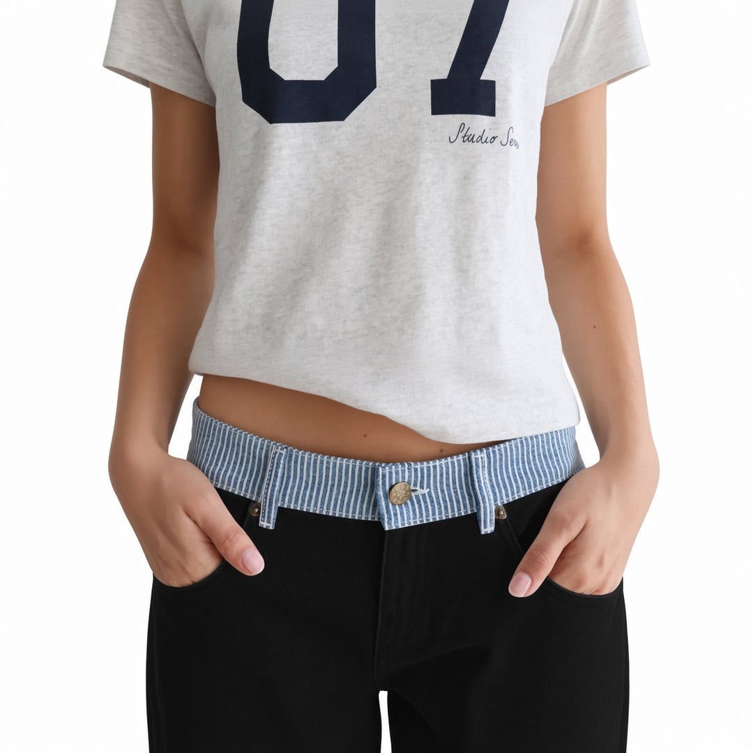 Contrast striped waistband and front pocket detail on The Elara Black pants