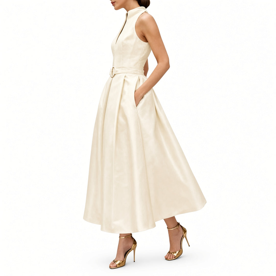 Apricot midi dress showing the belt and pleated skirt