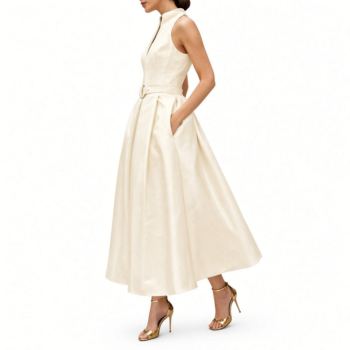 Apricot midi dress showing the belt and pleated skirt