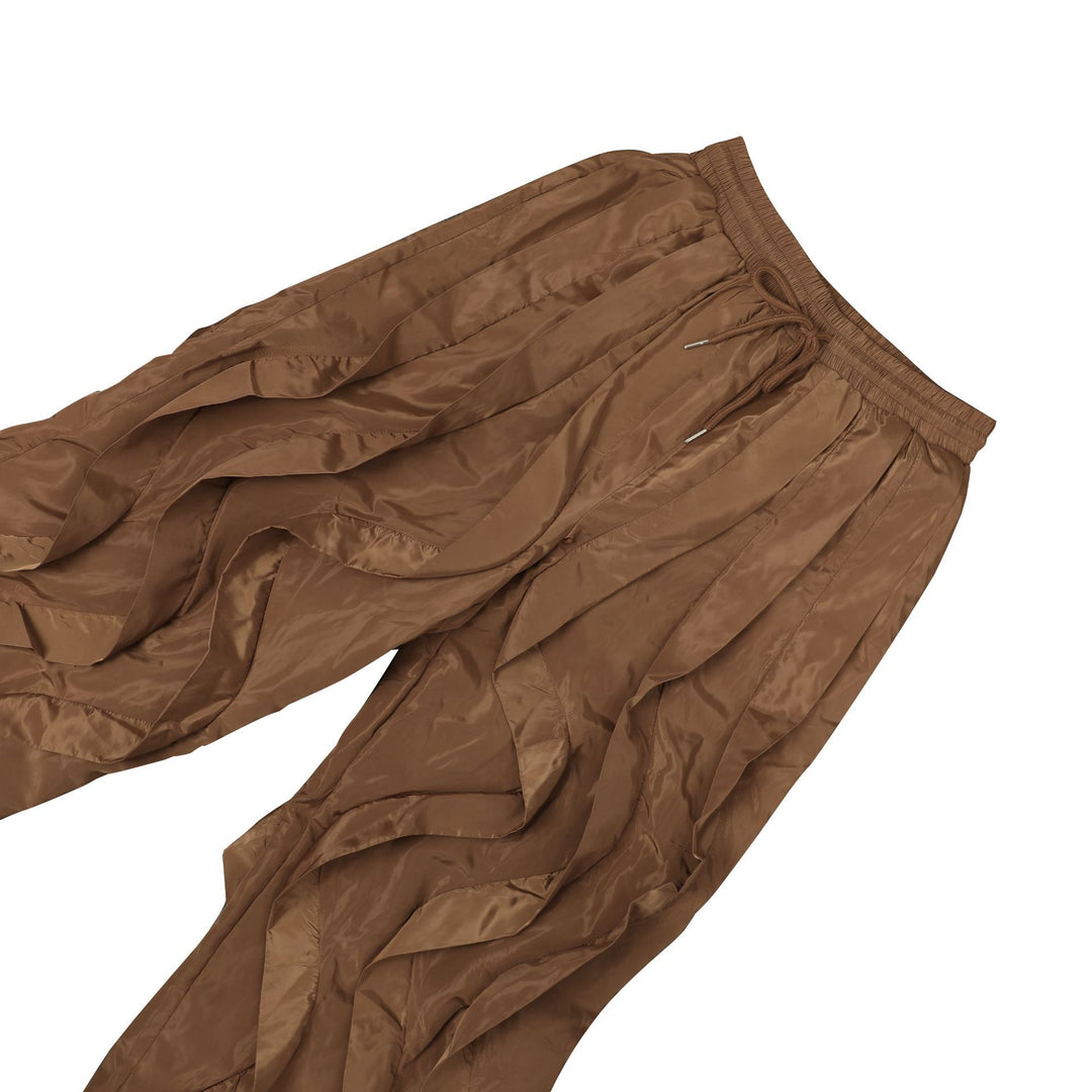 Close view of the layered wave panels and drawcord hem