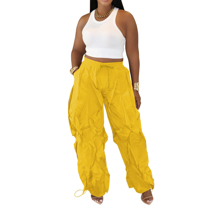 Yellow wave-cut drawstring cargo pants, front view
