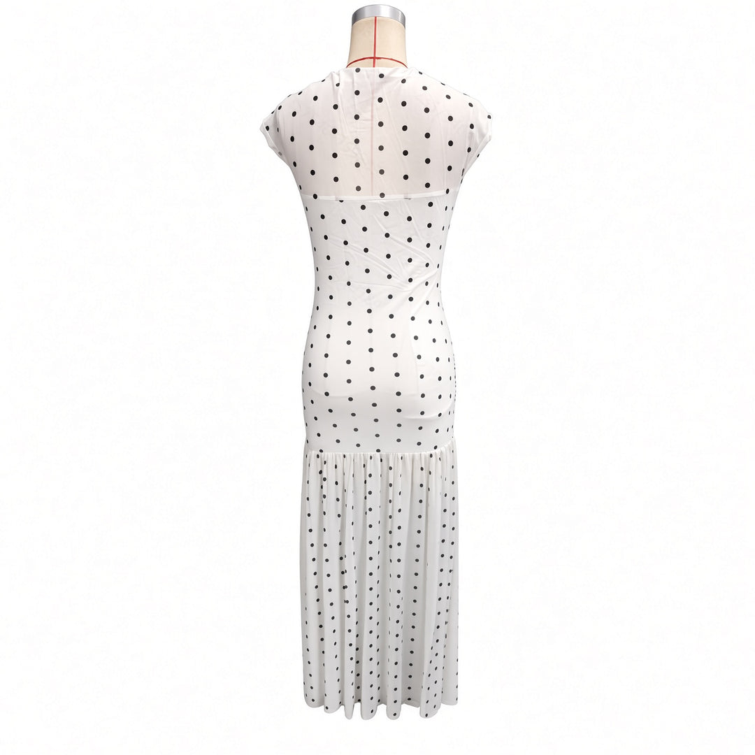 Isolated back view of the white polka-dot maxi dress