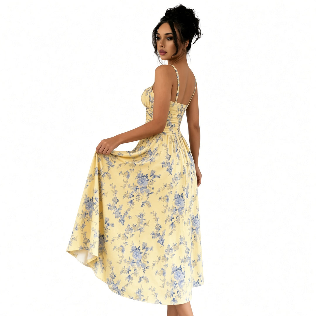 Three-quarter back view of the yellow floral midi dress