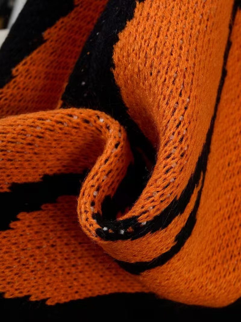 Close view of the knit texture and front pocket construction