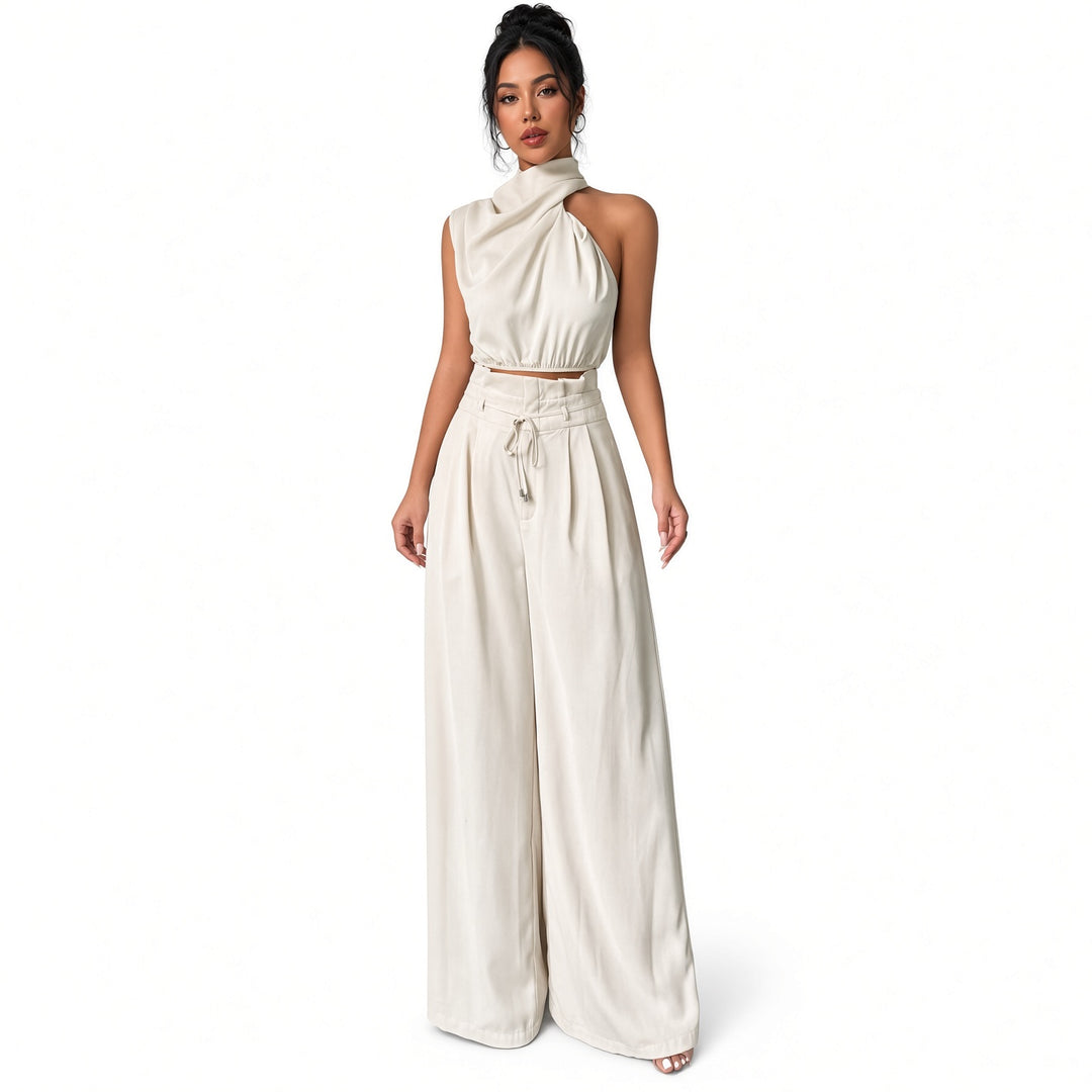 White draped one-shoulder crop-top and wide-leg pant set, front view