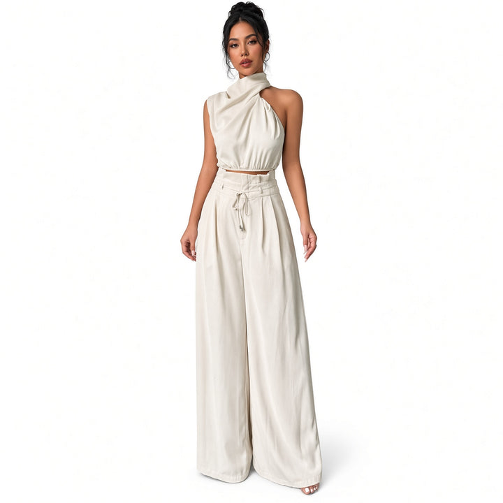 White draped one-shoulder crop-top and wide-leg pant set, front view