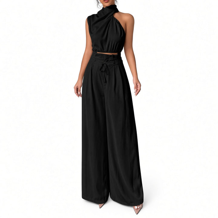 Black draped one-shoulder crop-top and wide-leg pant set, front view
